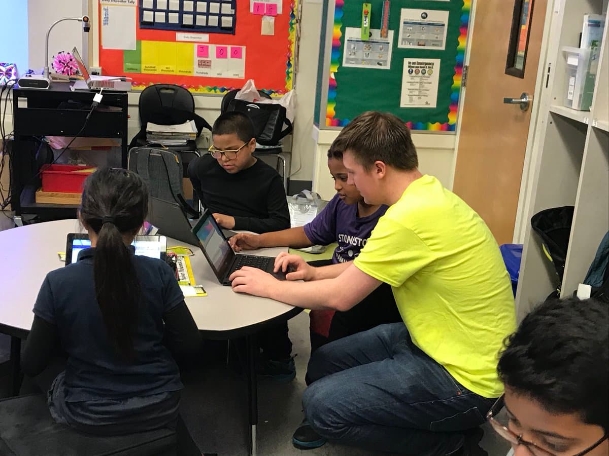 Livio helping a student with their code